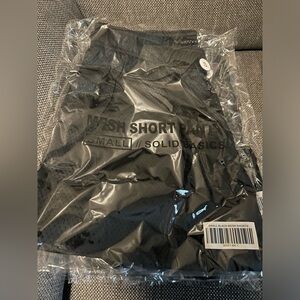 Black Mesh Gym Shorts. Deep Pockets with white drawstring.